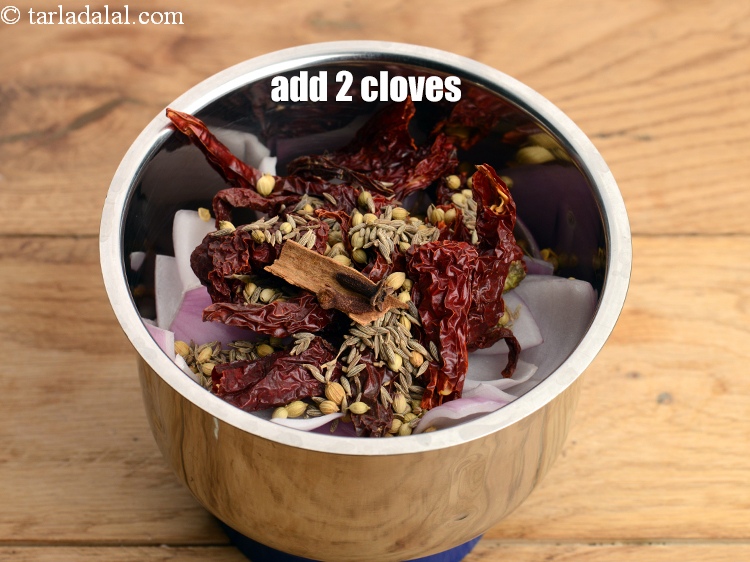 Step 10 – Add 2&nbsp;<a href="https://www.tarladalal.com/glossary-cloves-laung-lavang-322i">cloves (laung / lavang)</a>.
