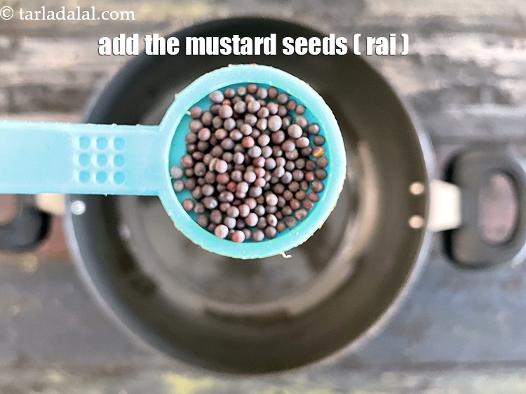 Step 14 – <meta charset="UTF-8" /> Add&nbsp;1/2 tsp&nbsp;<a href="glossary-mustard-seeds-sarson-rai-sarson-ke-beej-525i">mustard seeds (rai / sarson)</a>.