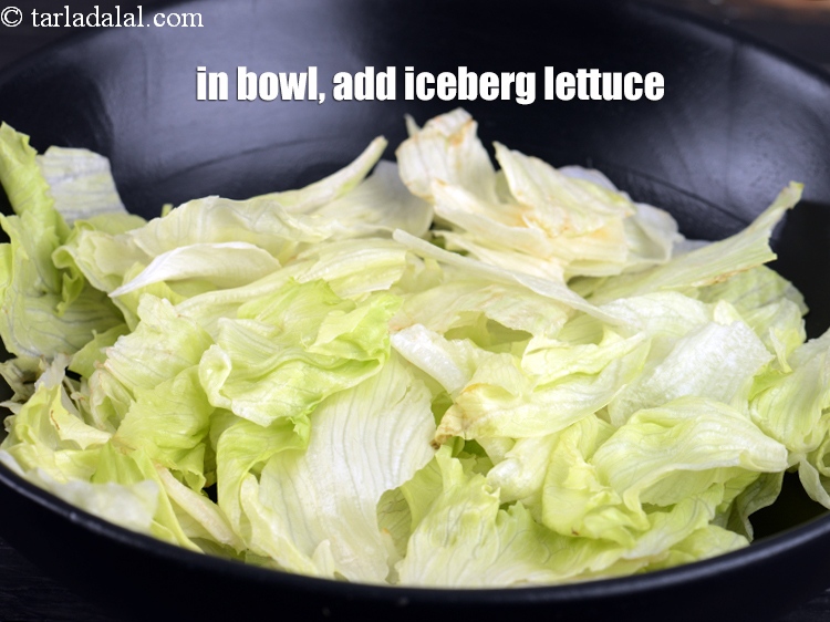 Step 9 – Just before serving, In a deep bowl, add 3 cups of <a href="https://www.tarladalal.com/glossary-iceberg-lettuce-iceberg-salad-ke-patte-499i">iceberg lettuce</a>, torn …
