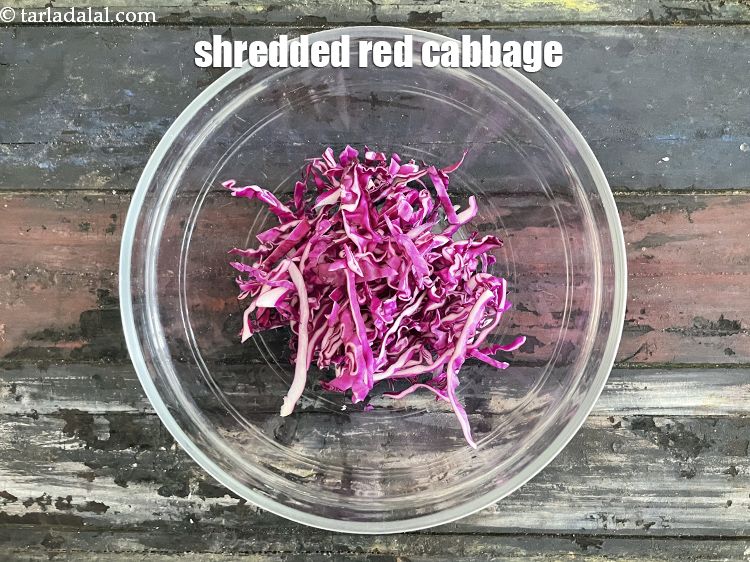 Step 12 – In a deep bowl put&nbsp;1/2 cup&nbsp;<a href="glossary-shredded-red-cabbage-2262i">shredded red cabbage</a>.