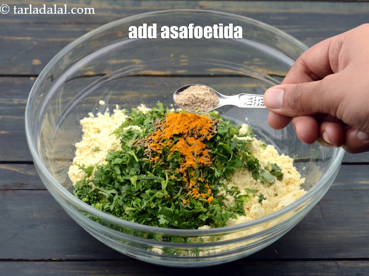 Step 10 – Add a pinch of <a href="https://www.tarladalal.com/glossary-asafoetida-hing-113i">asafoetida (hing)</a>.