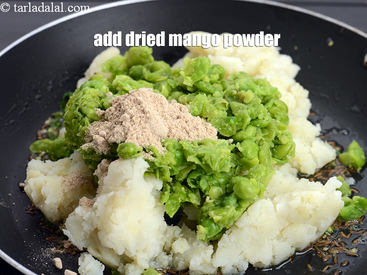 Step 10 – Add 1 tbsp <a href="https://www.tarladalal.com/glossary-dried-mango-powder-amchur-powder-148i">dried mango powder (amchur)</a>.