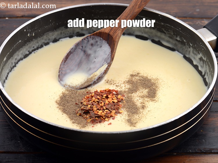 Step 9 – Add <a href="https://www.tarladalal.com/glossary-freshly-ground-black-pepper-kalimirch-powder-kali-mirch-ka-powder-567i">freshly ground black pepper (kalimirch)</a>&nbsp;to taste. &nbsp;