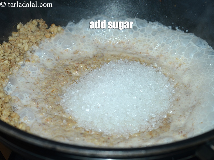 स्टेप 9 – १&nbsp;कप&nbsp;<a href=""https://www.tarladalal.com/glossary-sugar-chini-shakkar-hindi-278i"">शक्कर</a>&nbsp;<span style=""font-size:11pt""><span style=""font-family:Calibri,sans-serif""><span style=""background-color:white""><span style=""font-family:&quot;Nirmala UI&quot;,sans-serif""><span style=""color:black"">डालें।</span></span></span></span></span>