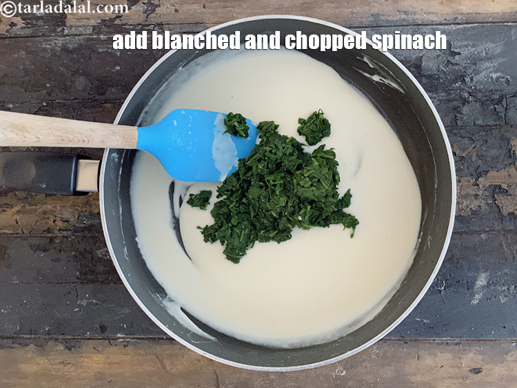 Step 22 – Add&nbsp;<meta charset="UTF-8" />1 cup&nbsp;<a href="glossary-blanched-and-chopped-spinach-1915i">blanched and chopped spinach (palak)</a>.