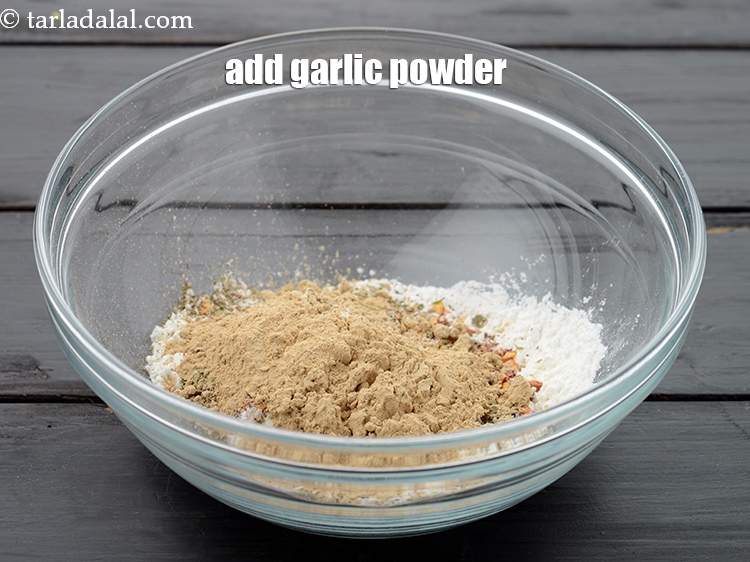 Step 9 – Add 1 tbsp&nbsp;<a href="https://www.tarladalal.com/glossary-garlic-powder-lehsun-ka-powder-lahsun-ka-powder-351i">garlic (lehsun) powder</a>.&nbsp;