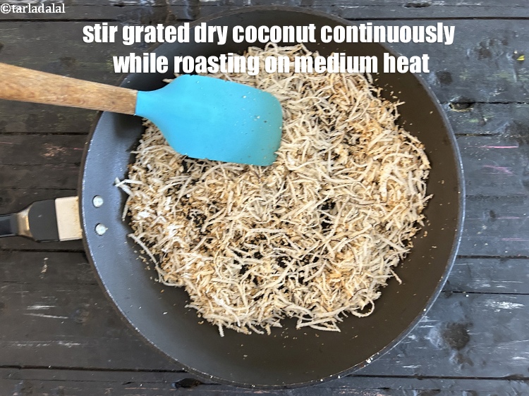 Step 9 – Stir grated dry coconut continuously while roasting on medium heat. <ol> </ol>
