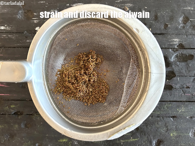 Step 9 – Strain it using a strainer.&nbsp;Discard the ajwain.