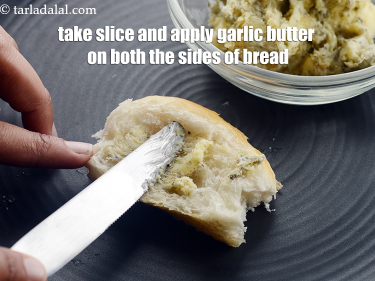 Step 9 – Take a slice and apply garlic butter on both the sides of the bread.