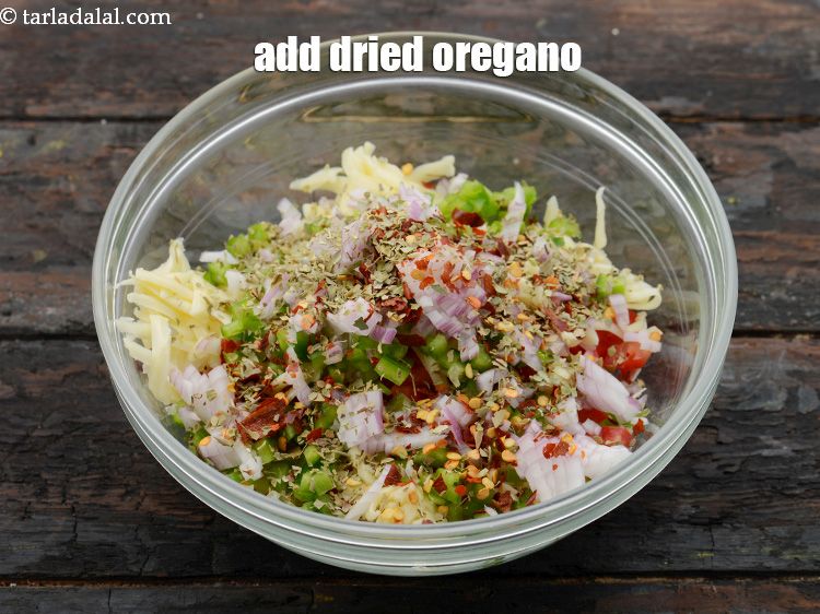 Step 9 – Add 1 tsp&nbsp;<a href="https://www.tarladalal.com/glossary-dried-oregano-268i">dried oregano</a>.&nbsp;