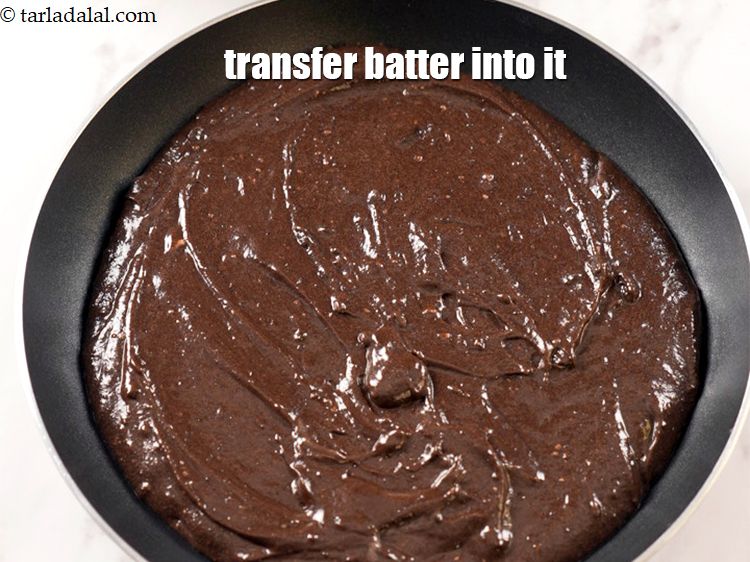 Step 9 – Transfer the batter into a butter paper lined pan.