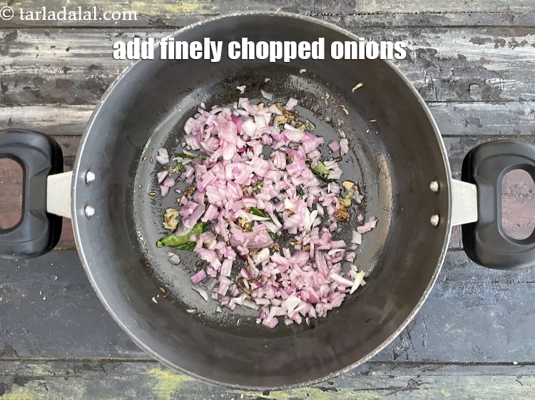 Step 25 – Add&nbsp;1/2 cup&nbsp;finely&nbsp;<a href="https://tarladalal.com/glossary-chopped-onions-722i">chopped onions</a>.