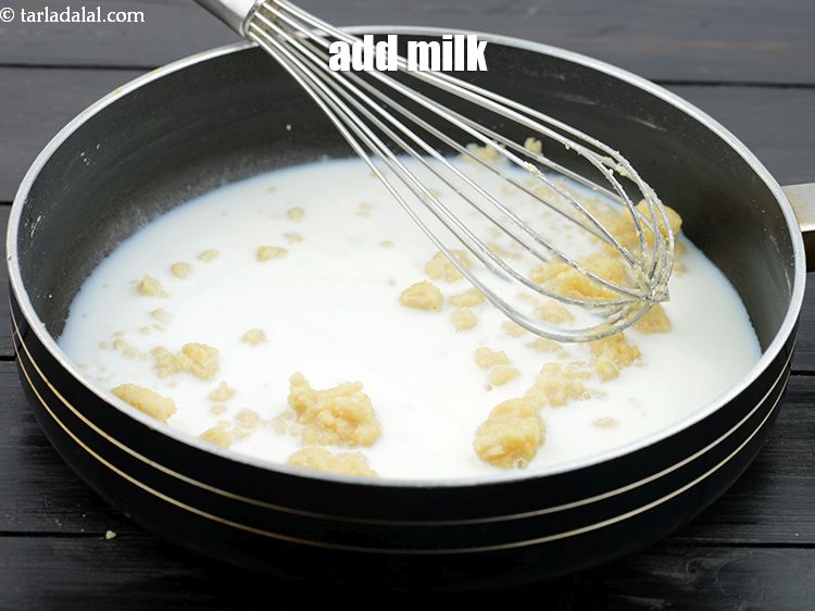 Step 10 – Add the 1/2 cup&nbsp;<a href="https://www.tarladalal.com/glossary-milk-doodh-full-cream-milk-514i">milk</a>.&nbsp;