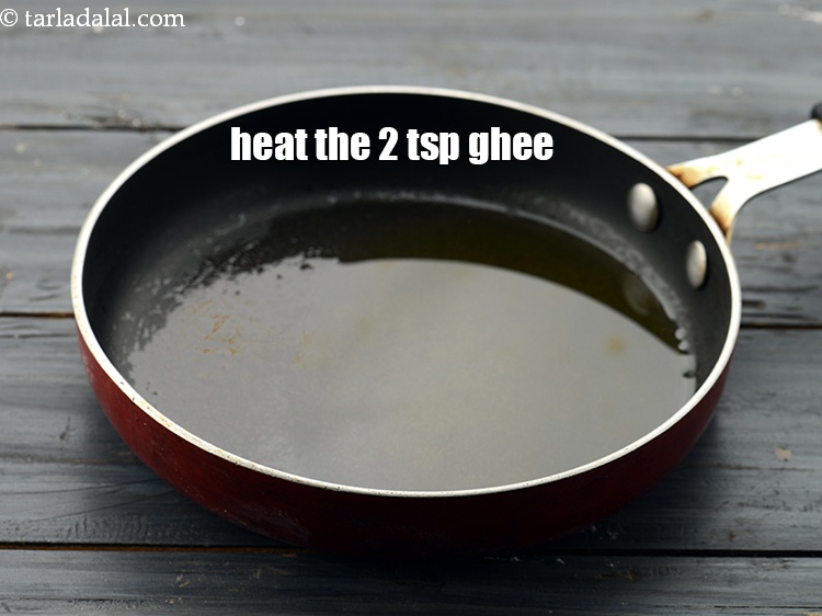Step 18 – Heat the 2 tsp&nbsp;<a href="https://www.tarladalal.com/glossary-ghee-245i">ghee</a> in a small non-stick pan.