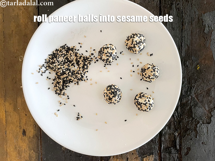Step 13 – Roll the paneer balls in sesame seeds mixture.