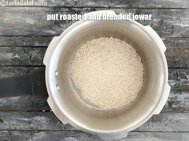 Step 18 – In a pressure cooker put&nbsp;<meta charset="UTF-8" />1/2 cup&nbsp;coarsely&nbsp;<a href="glossary-powdered-jowar-2210i">powdered jowar</a>. <strong>See above step by step …