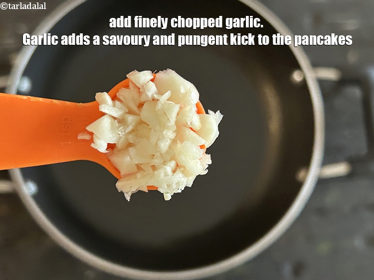 Step 10 – Add&nbsp;1 tsp&nbsp;finely&nbsp;<a href="https://www.tarladalal.com/glossary-chopped-garlic-790i">chopped garlic (lehsun)</a>.&nbsp;Garlic adds a savory and pungent kick to the pancakes. This …
