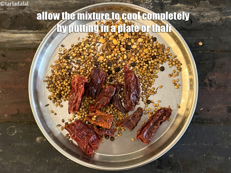 Step 11 – Allow the mixture to cool completely by putting in a plate or thali.