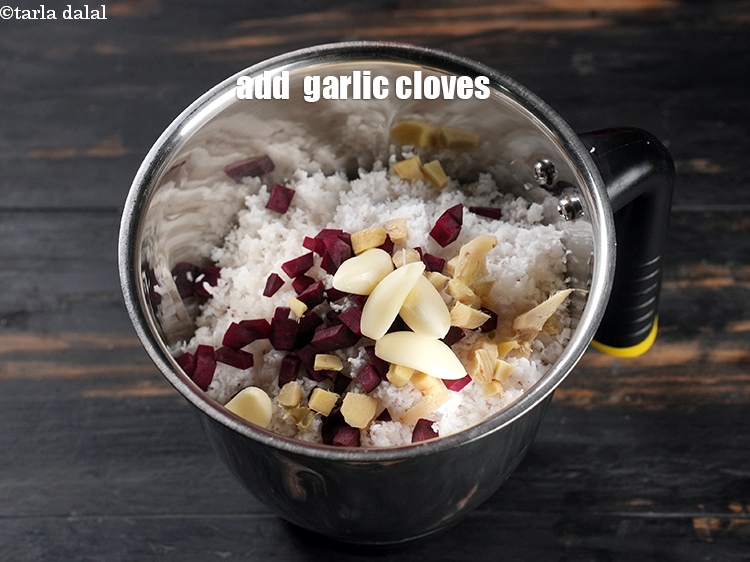 Step 10 – Add 4 <a href="https://www.tarladalal.com/glossary-garlic-cloves-1857i">garlic (lehsun) cloves</a>.