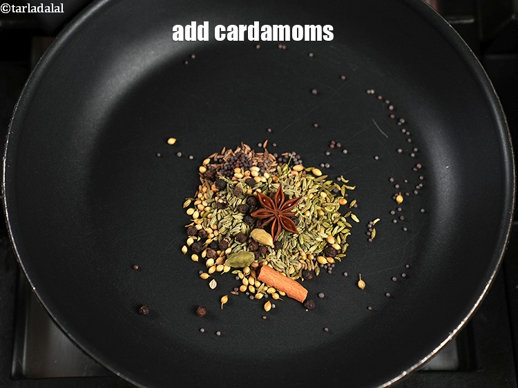 Step 10 – Add 2&nbsp;<a href="https://www.tarladalal.com/glossary-cardamom-elaichi-262i">cardamoms (elaichi)</a>.