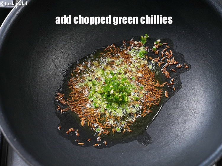Step 10 – Add 2 tsp finely&nbsp;<a href="https://www.tarladalal.com/glossary-chopped-green-chilli-820i">chopped green chillies</a>.