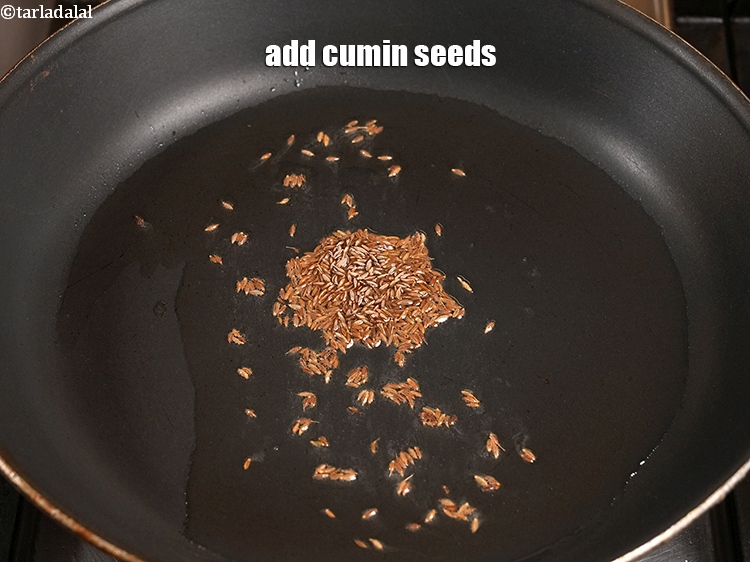 Step 10 – Add 1 tsp <a href="https://www.tarladalal.com/glossary-cumin-seeds-jeera-zeera-381i">cumin seeds (jeera)</a>.