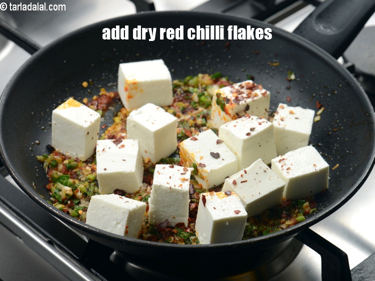 Step 10 – Add 1 tsp <a href="https://www.tarladalal.com/glossary-dry-red-chilli-flakes-paprika-338i">dry red chilli flakes (paprika)</a>.
