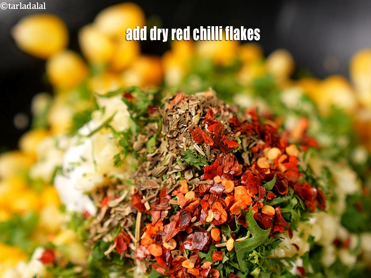 Step 10 – Add &frac12; tsp <a href="https://www.tarladalal.com/glossary-dry-red-chilli-flakes-paprika-338i">dry red chilli flakes (paprika)</a>.