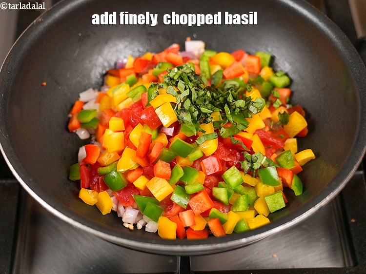 Step 10 – Add 1 tbsp finely &nbsp;<a href="https://www.tarladalal.com/glossary-chopped-basil-804i">chopped basil</a>.