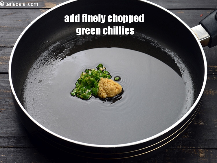 Step 11 – Add 1&frac12; tsp finely&nbsp;<a href="https://www.tarladalal.com/glossary-chopped-green-chilli-820i">chopped green chillies</a>.&nbsp;