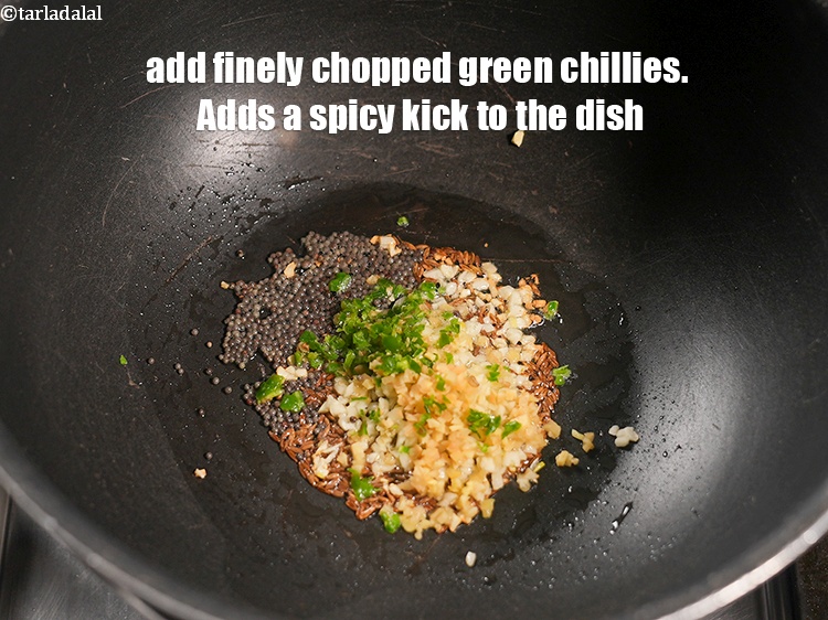 Step 10 – Add 1 tsp finely <a href="https://www.tarladalal.com/glossary-chopped-green-chilli-820i">chopped green chillies</a>. Adds a spicy kick to the dish.