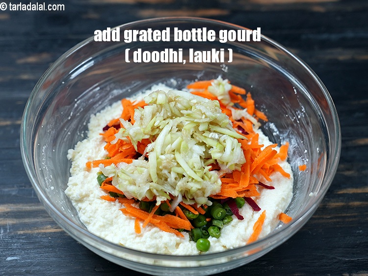 Step 11 – Add &frac14; cup <a href="https://www.tarladalal.com/glossary-grated-bottle-gourd-1048i">grated bottle gourd (doodhi / lauki)</a>.