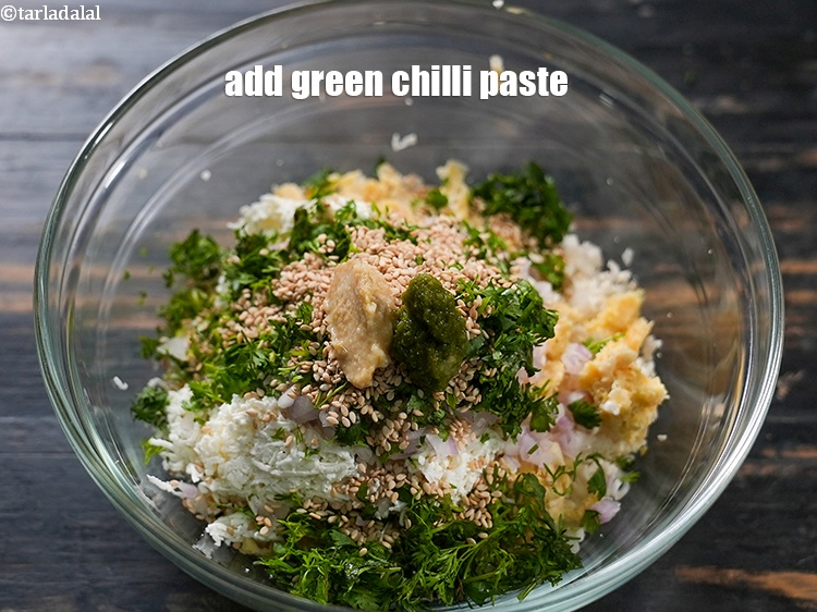 Step 10 – Add &frac12; tsp <a href="https://www.tarladalal.com/glossary-green-chilli-paste-hari-mirch-ki-paste-mirchi-paste-333i">green chilli paste</a>.