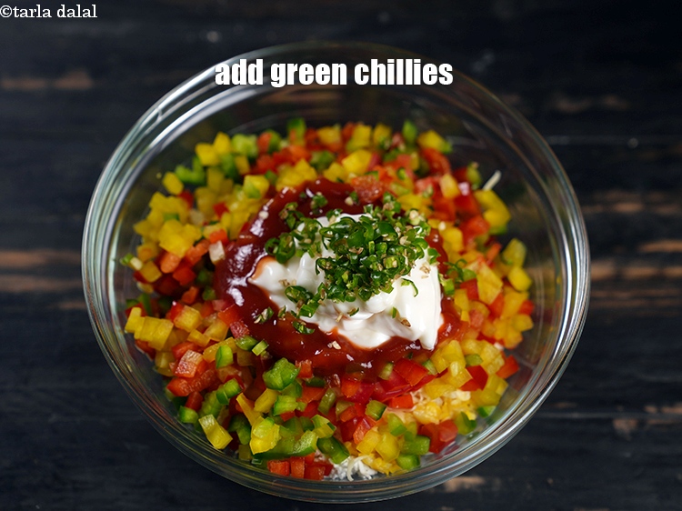 Step 10 – Add 1 tsp finely <a href="https://www.tarladalal.com/glossary-chopped-green-chilli-820i">chopped green chillies</a>.
