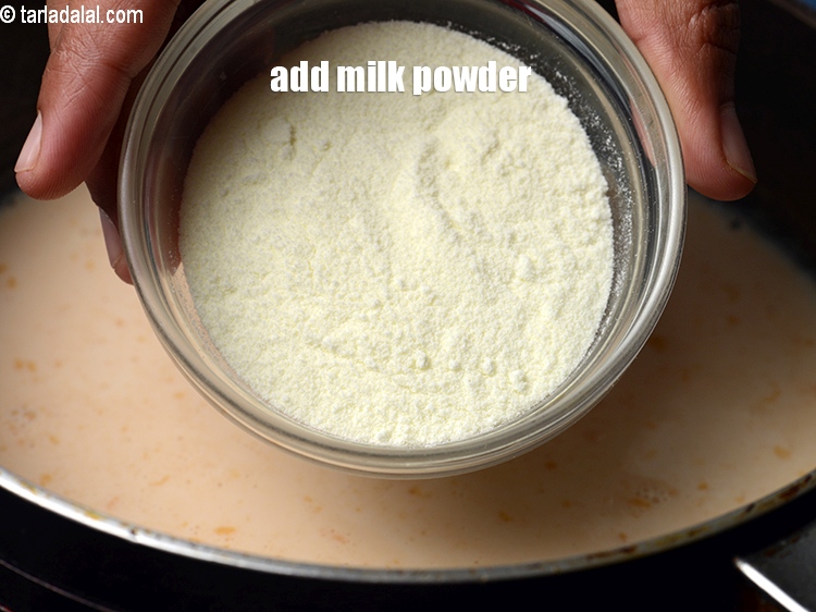 Step 10 – Add &frac14; cup <a href="https://www.tarladalal.com/glossary-milk-powder-517i">milk powder</a>.
