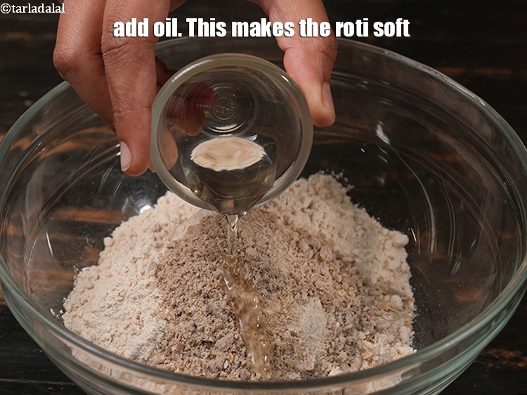Step 10 – Add 1 tsp oil. This makes the roti soft.