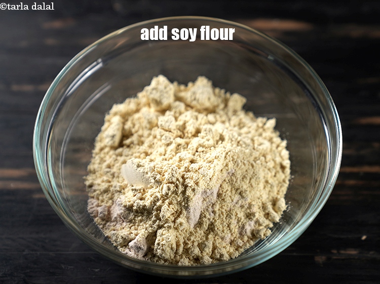 Step 10 – Add &frac12; cup <a href="https://www.tarladalal.com/glossary-soy-flour-soya-flour-soya-atta-617i">soy flour</a>.