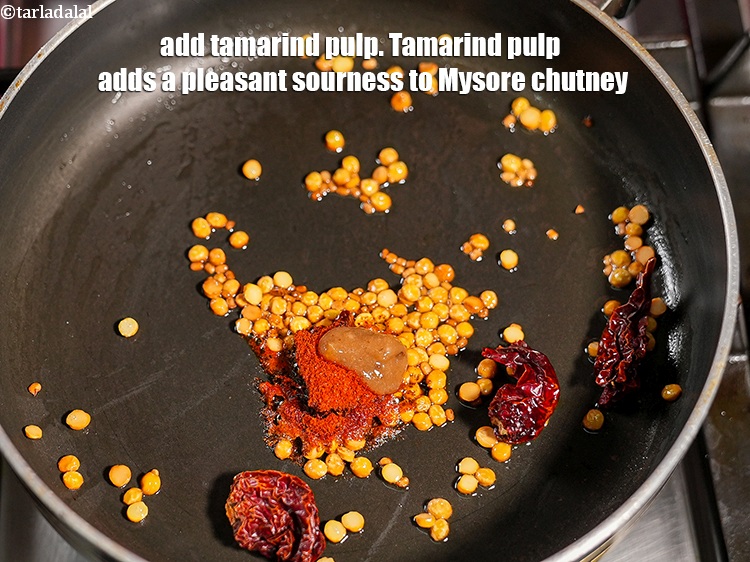 Step 10 – Add 1 tsp <a href="https://www.tarladalal.com/glossary-tamarind-pulp-tamarind-extract-imli-ka-pulp-838i">tamarind (imli) pulp</a>. Tamarind pulp adds a pleasant sourness to Mysore …