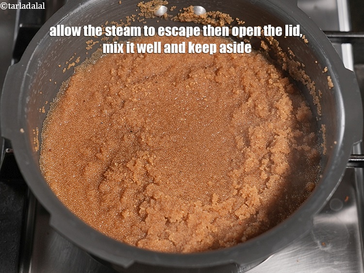 Step 10 – Allow the steam to escape then open the lid, mix it well and keep aside.