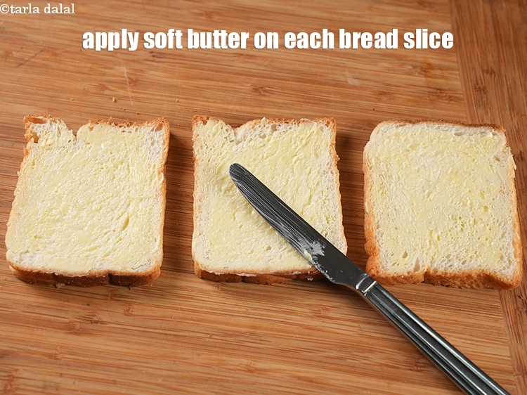 Step 10 – Apple 1 tsp <a href="https://www.tarladalal.com/glossary-soft-butter-naram-makhan-1942i">soft butter</a> on each bread slice.