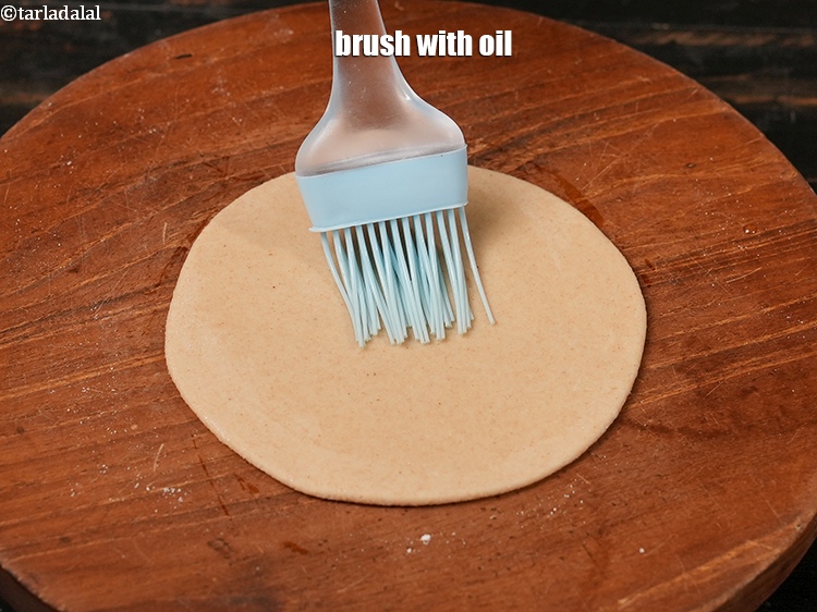 Step 13 – Brush with &frac14; tsp of oil.