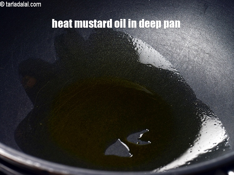 Step 10 – Heat the remaining 1 tsp mustard oil in a deep pan.