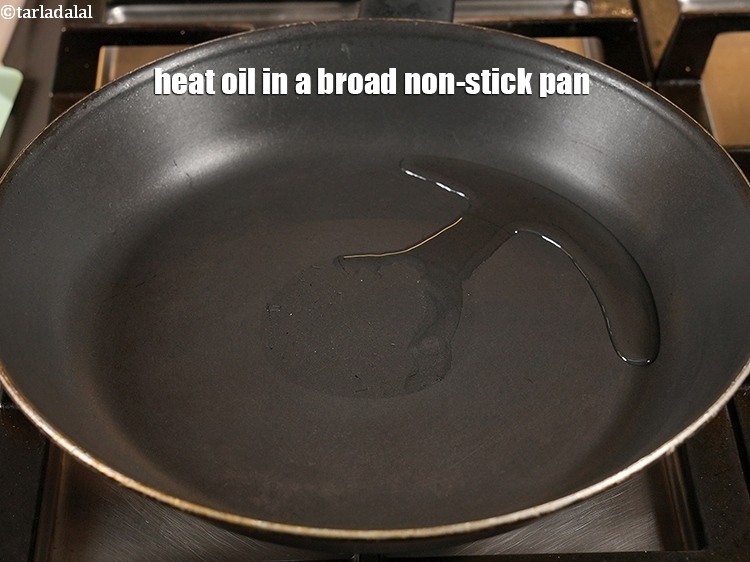 Step 10 – Heat 1 tsp <a href="https://www.tarladalal.com/glossary-oil-671i">oil</a> in a broad non-stick pan.