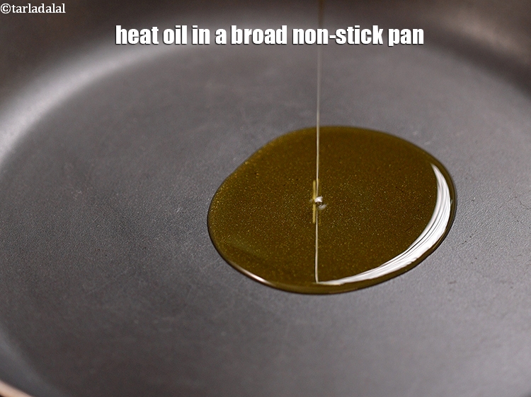 Step 10 – Heat 1 tbsp <a href="https://www.tarladalal.com/glossary-oil-671i">oil</a> in a broad non-stick pan.