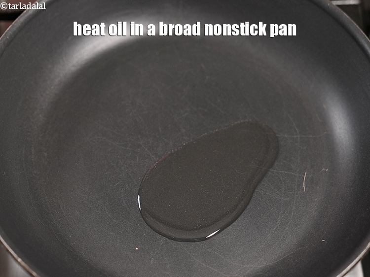 Step 10 – Heat 2 tsp oil in a broad nonstick pan.