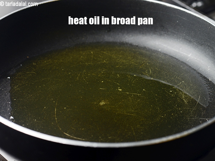 Step 11 – Heat oil in a broad non-stick pan.