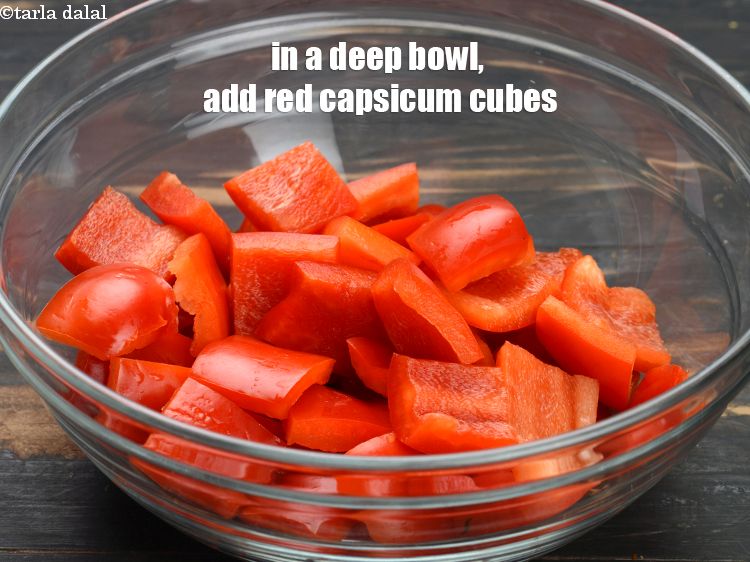 Step 12 – In a deep bowl, add 2 cups <a href="https://www.tarladalal.com/glossary-red-capsicum-cubes-2077i">red capscium cubes</a>.