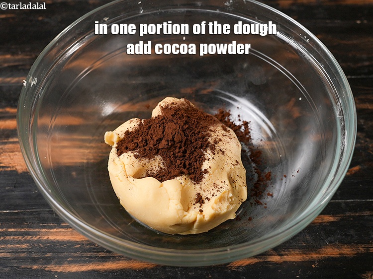 Step 10 – In one portion of the dough, add 2 tsp&nbsp;<a href="https://www.tarladalal.com/glossary-cocoa-powder-284i">cocoa powder</a>.