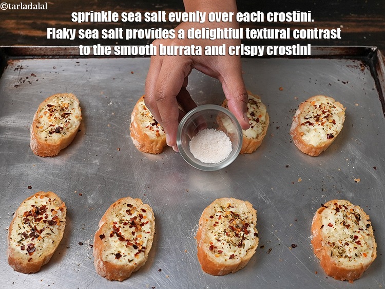 Step 10 – Sprinkle 1/8 tsp of <a href="https://www.tarladalal.com/glossary-sea-salt-khada-namak-421i">sea salt (khada namak)</a> evenly over each crostini. &nbsp;Flaky sea …
