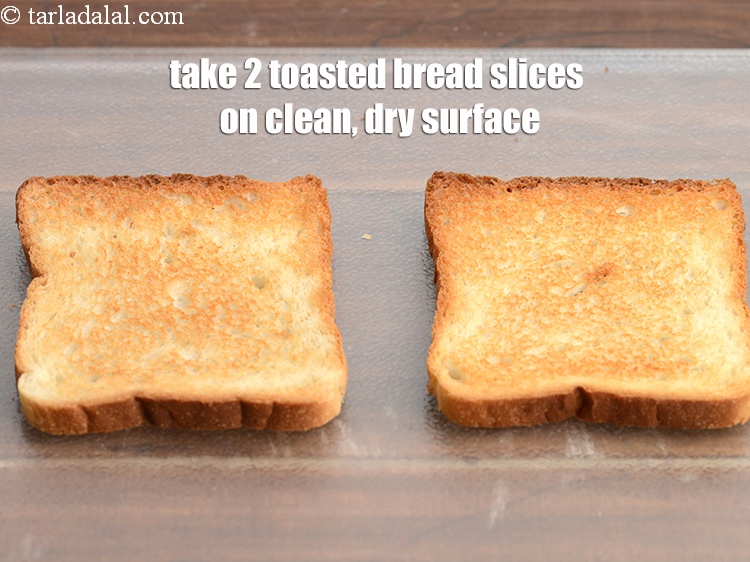 Step 10 – Take 2&nbsp;<a href="https://tarladalal.com/glossary-toasted-bread-slices-2334i">toasted bread slices</a> on a clean, dry surface.&nbsp;